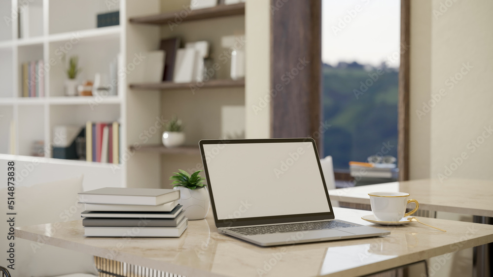 Portable notebook laptop on a luxury marble countertop in a luxury living room. Portable notebook laptop on a luxury marble countertop in a luxury living room.