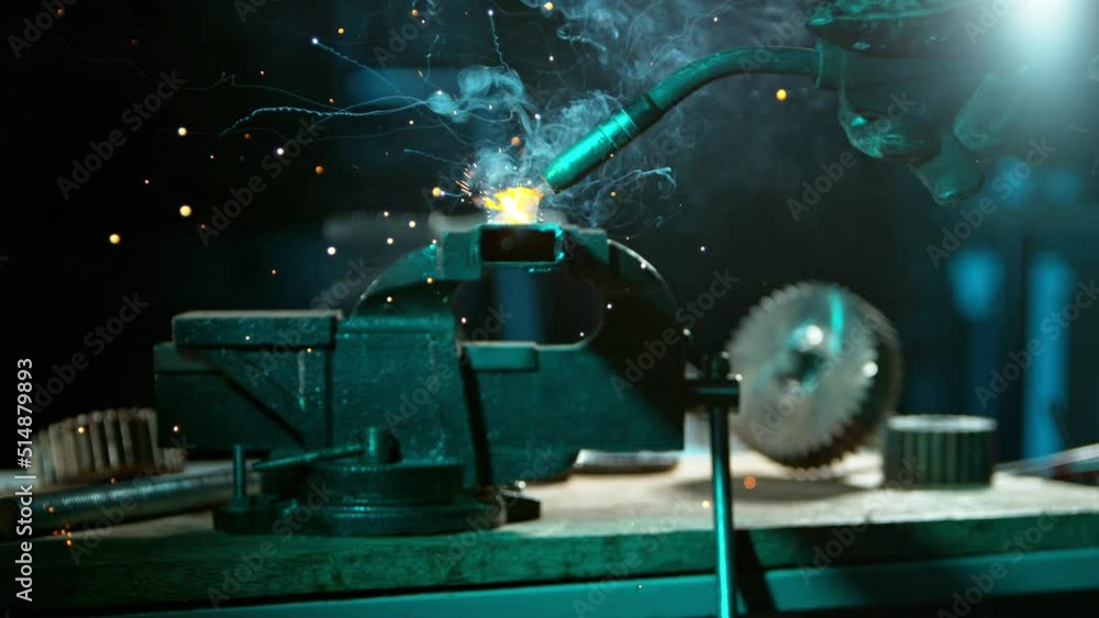 Super Slow Motion Of Working Welder In Workshop. Detail shot, low depth of focus. Filmed On High Speed Cinema Camera, 1000 fps. Super Slow Motion Of Working Welder In Workshop. Detail shot, low depth of focus. Filmed On High Speed Cinema Camera, 1000 fps.