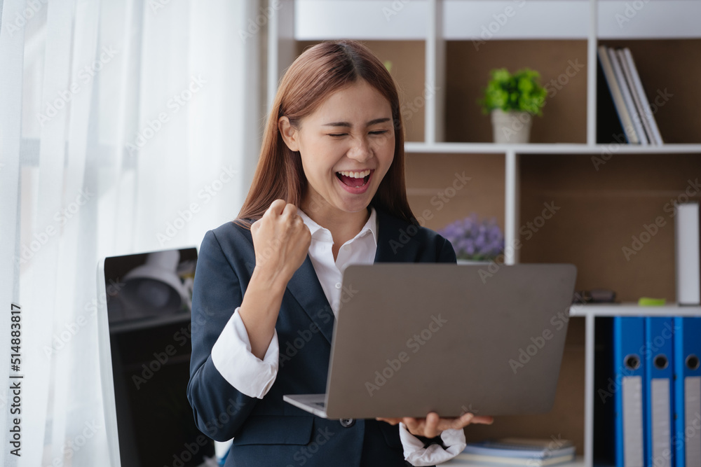 Business woman happy and cheerful for successful on project via laptop in office space. Business woman happy and cheerful for successful on project via laptop in office space.