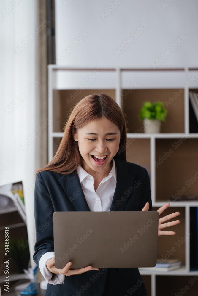 Business woman happy and cheerful for successful on project via laptop in office space. Business woman happy and cheerful for successful on project via laptop in office space.