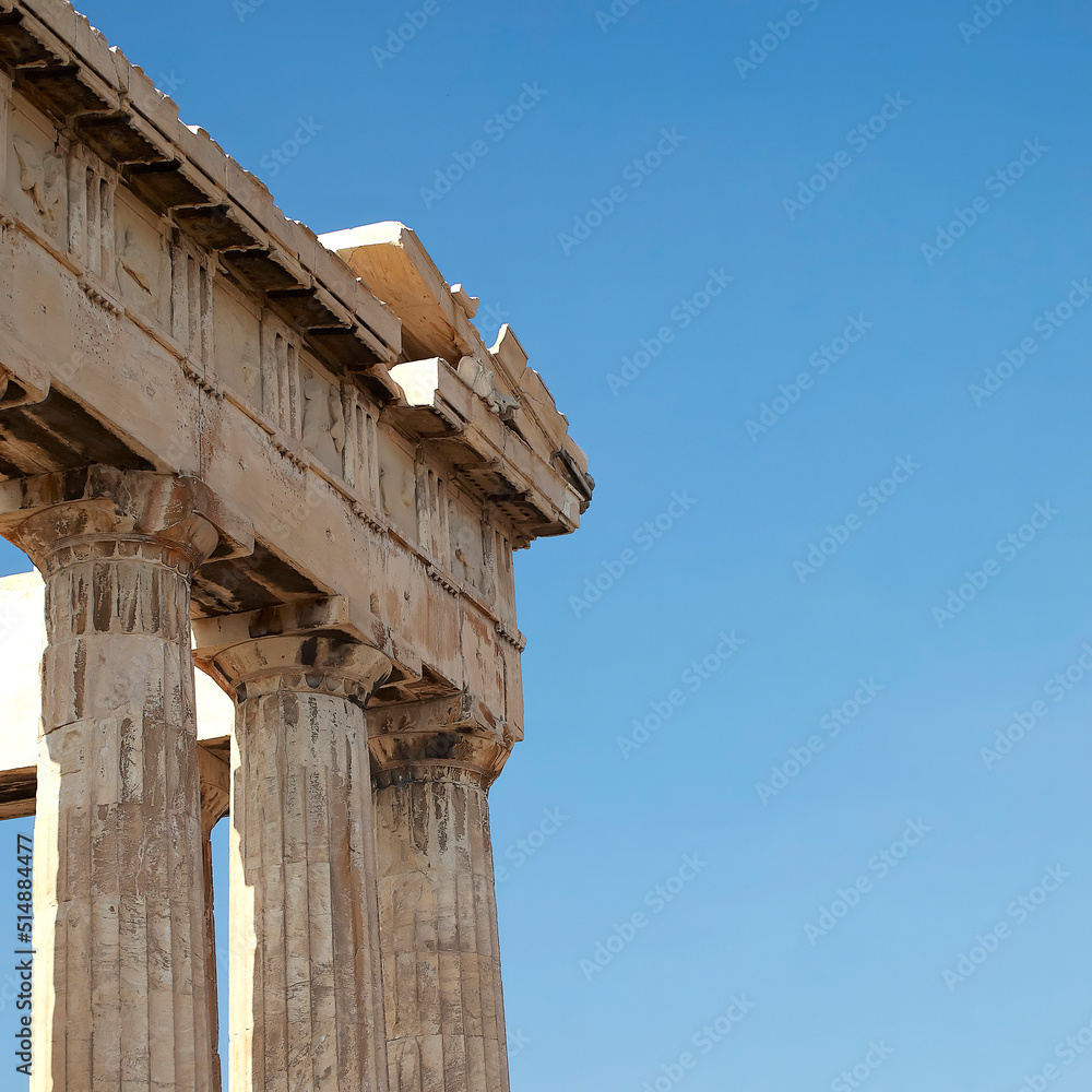 Detail of Parthenon's temple east facade, Acropolis. Travel in Athens, Greece. Space for your text on the blue sky. Detail of Parthenon's temple east facade, Acropolis. Travel in Athens, Greece. Space for your text on the blue sky.