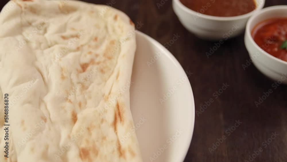 Nan to eat with Indian curry that rotates on the table Nan to eat with Indian curry that rotates on the table