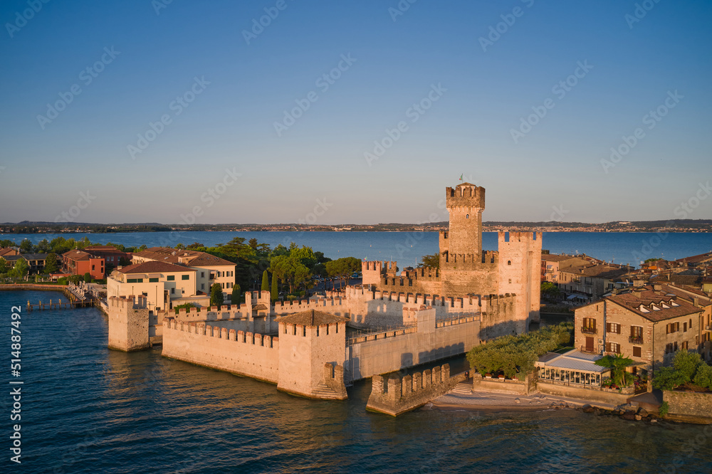 Sirmione town aerial view on Lake Garda, Italy. View of Scaligero Castle at sunrise. Historic Water Castle on Lake Garda.