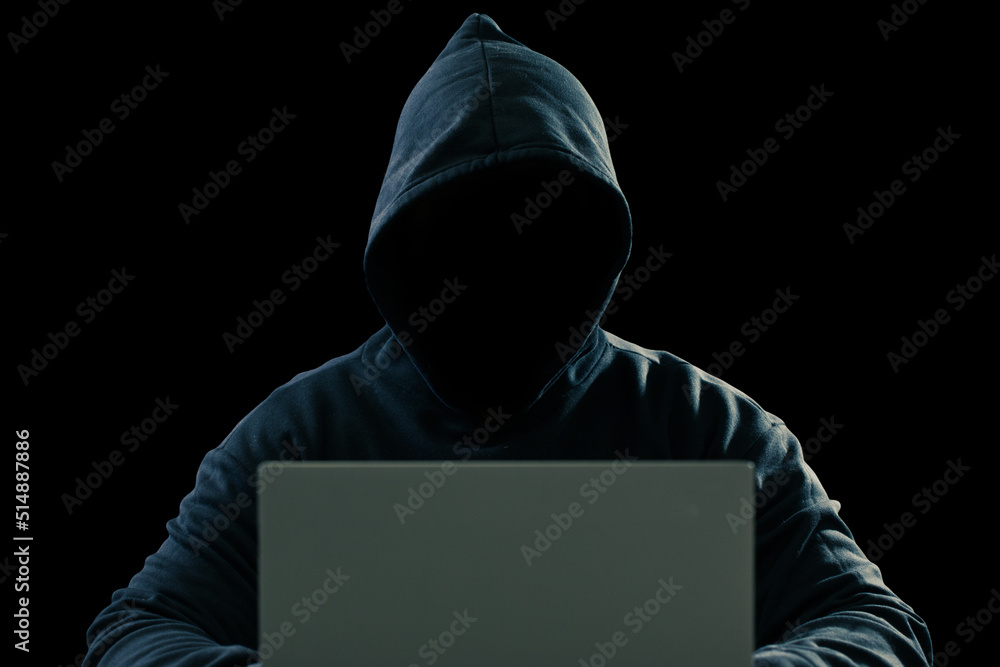 Big financial data theft concept. An anonymous hacker is hacking highly-protected financial data through computers. Big financial data theft concept. An anonymous hacker is hacking highly-protected financial data through computers.