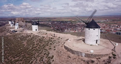 Aerial Aerial view of Route of Don Quixote with windmills in Consuegra, Spainof Wind mills at knolls at Consuegra, Toledo region, Spain . High quality 4k footage photo