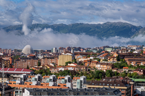 City of Oviedo with the mountains in the background and the sky with clouds, Asturias, Spain.