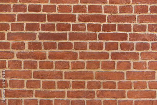 Empty brick red wall. background of a old brick house.