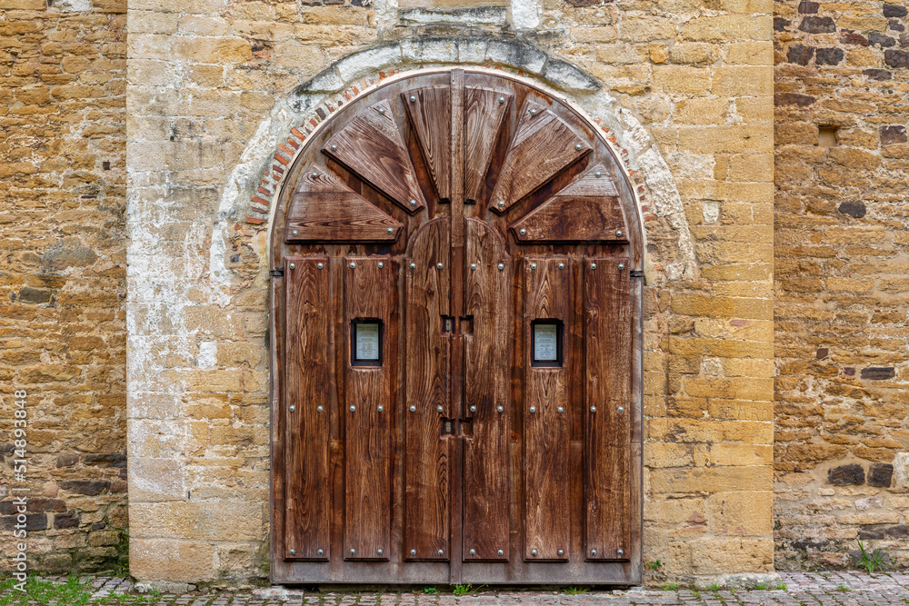 Wooden entrance gate to the Church and facade of San Miguel de Lillo, Oviedo, Asturias, Spain.
