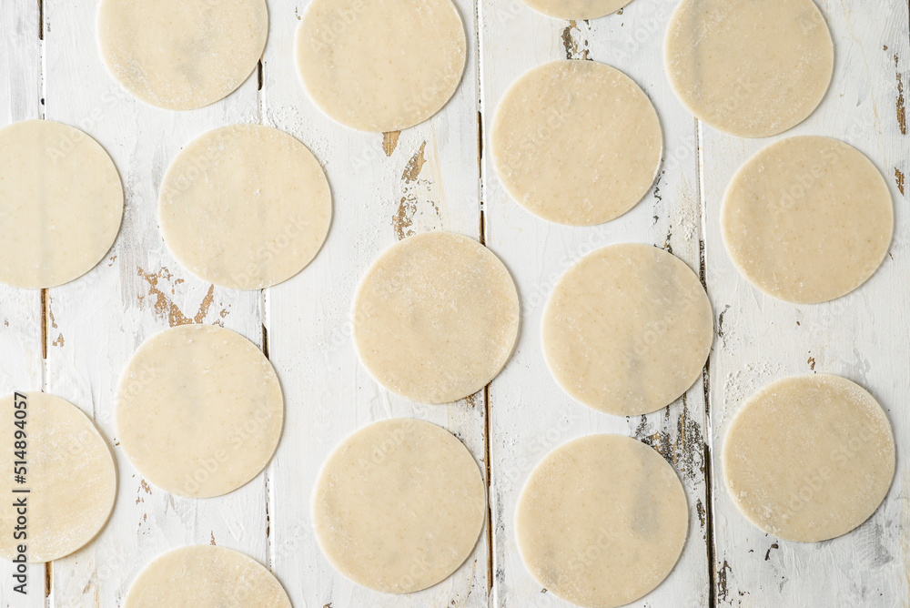 dough for dumplings circles on the board