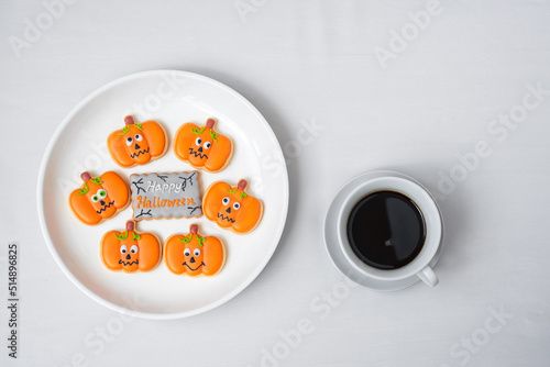 hot coffee cup with funny Halloween Cookies. Happy Halloween day, Trick or Threat, Hello October, fall autumn, Traditional, party and holiday concept