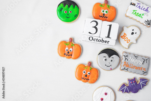 Halloween funny Cookies with 31 October calendar on white background. Trick or Threat, Happy Halloween, Hello October, fall autumn, Festive, party and holiday concept