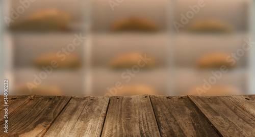 Wood top table Blur coffee shop or cafe restaurant with abstract bokeh light image background. People in store Blur Background or design key visual layout