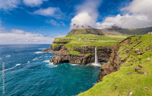 Fototapeta Naklejka Na Ścianę i Meble -  Gasadalur with Mulafossur waterfall on Vagar, Faroe Islands
