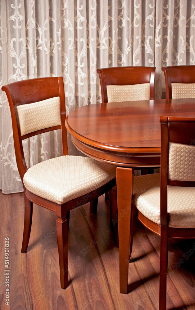 Contemporary dining room, a table with chairs in the foreground Contemporary dining room, a table with chairs in the foreground