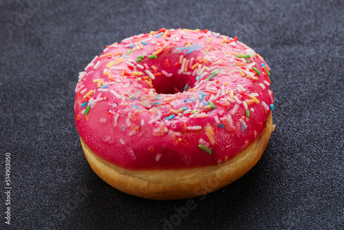 Sweet glazed struwberry donut with icing © Andrei Starostin