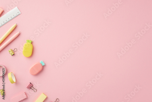Back to school concept. Top view photo of colorful stationery pens pineapple shaped erasers adhesive tape ruler and binder clips on isolated pink background with empty space
