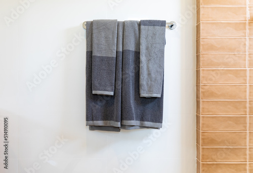 bathroom towel dryer on gray wall background with copy space © kowitstockphoto