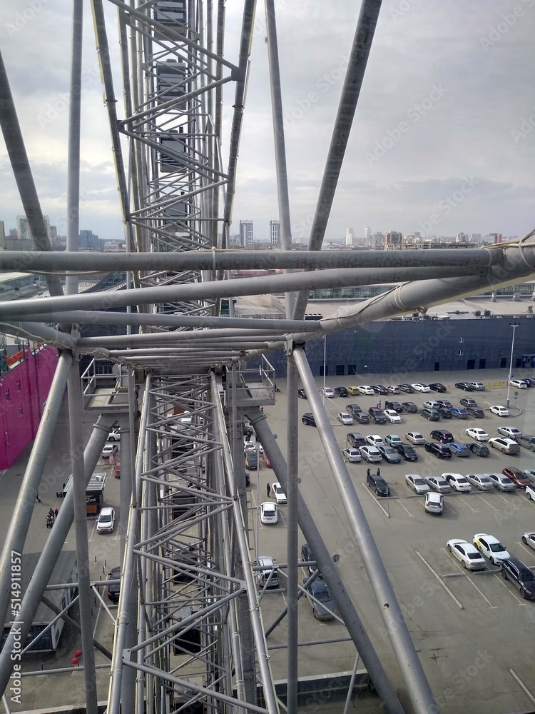 Iron Ferris wheel structure with a view from the cabin Iron Ferris wheel structure with a view from the cabin