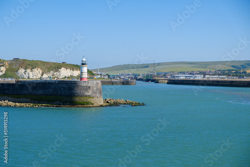 Harbour entrance with lighthouse Newhaven, East Sussex, England on a summer day photo