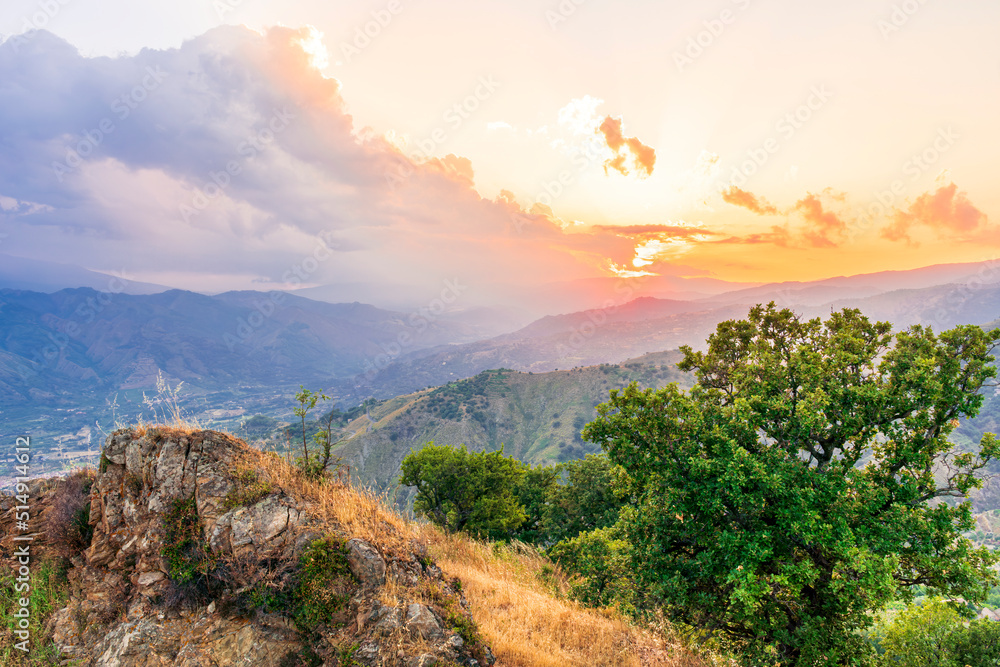 Mountain valley during sunset or sunrise. Natural spring or summer season landscape