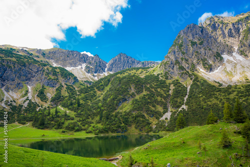 Germany, Bavaria, Scenic view of Unterer Gaisalpsee lake and Rubihorn mountain in summer photo