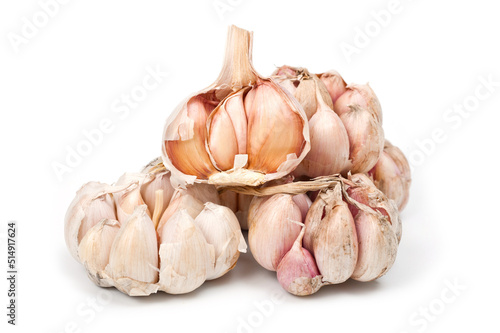 Several large heads of garlic, shot against a white background.