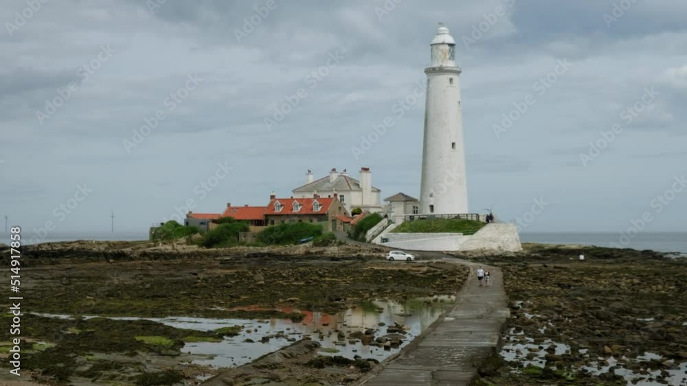 Mid clip of St Mary’s Lighthouse on Tyneside as a young couple walk across the causeway Mid clip of St Mary’s Lighthouse on Tyneside as a young couple walk across the causeway
