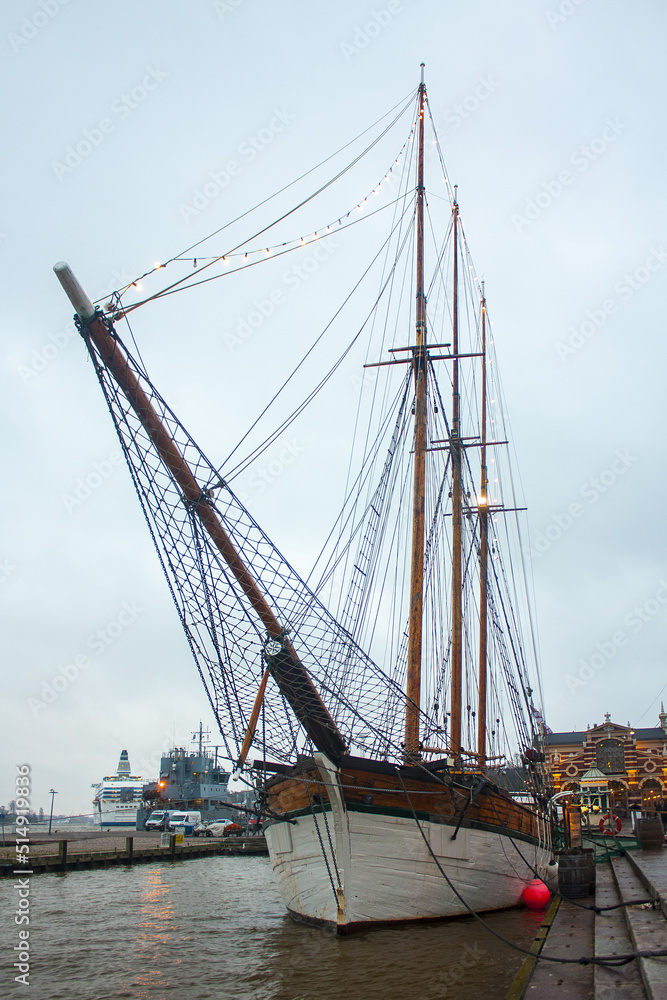 Old Wooden Sailing Vessel Ship Schooner (unusual restaurant in city center) is moored to the city pier in Helsinki, Finland
