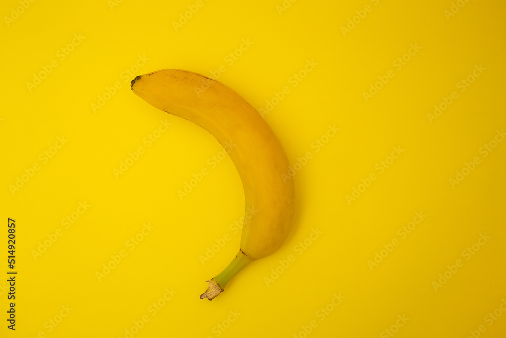 Bananas on yellow background, monochrome Bananas on yellow background, monochrome