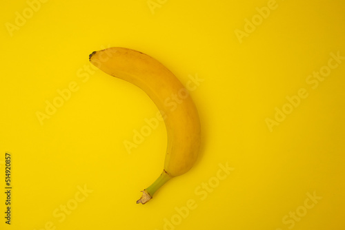 Bananas on yellow background, monochrome