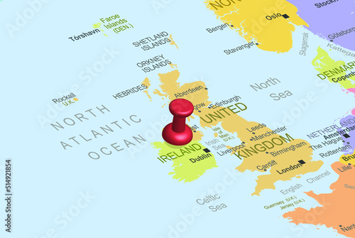 Ireland with red fastener pushpin on europe map, close up Ireland, travel idea, colorful map with location icon, vacation concept