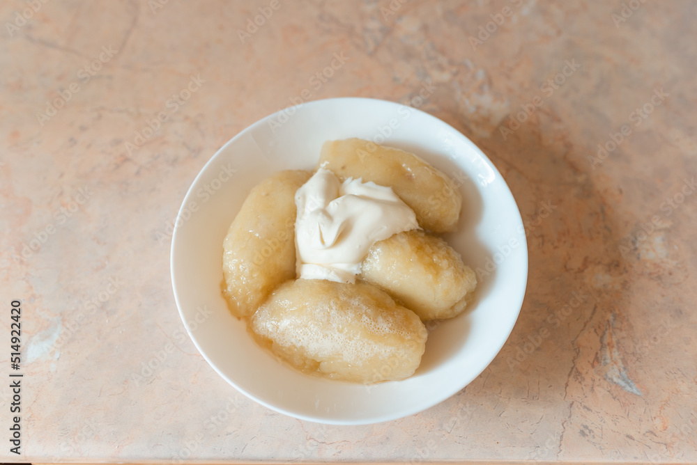 Traditional Lithuanian dish meal cuisine, stuffed meat potato dumpling,most popular Lithuanian national dish on a plate. Traditional Lithuanian dish meal cuisine, stuffed meat potato dumpling,most popular Lithuanian national dish on a plate.