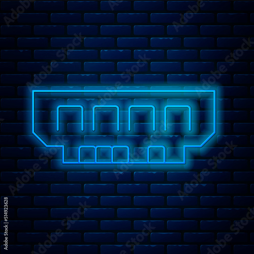 Glowing neon line RAM, random access memory icon isolated on brick wall background. Vector