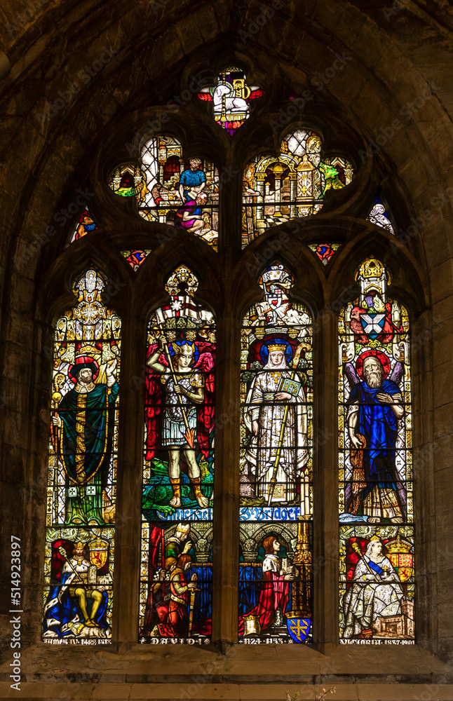 close-up view of a historic stained glass window inside the St. Michael's Parish Church in Linlithgow