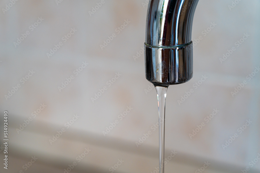Tap from which drops of water flow. Drought, shortage, rationing and proper use of water. Tap from which drops of water flow. Drought, shortage, rationing and proper use of water.