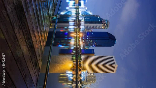 vertical Time-lapse of Bangkok city night view at Benjakitti Park, Bangkok, Thailand photo