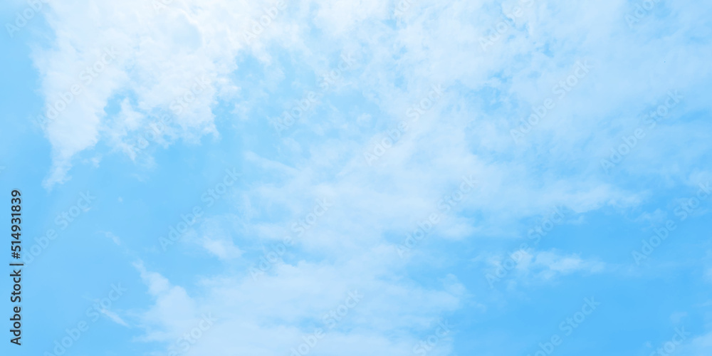 Abstract clear view of natural cloudy sky of winter seasons, Cloudy and bright shinny blue sky background with white clouds, fluffy and blurry summer sky background for wallpaper and design. Abstract clear view of natural cloudy sky of winter seasons, Cloudy and bright shinny blue sky background with white clouds, fluffy and blurry summer sky background for wallpaper and design.