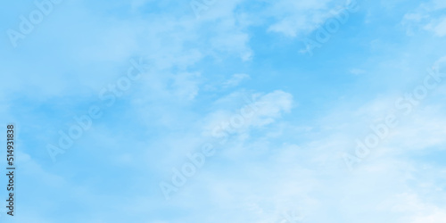 Abstract clear view of natural cloudy sky of winter seasons, Cloudy and bright shinny blue sky background with white clouds, fluffy and blurry summer sky background for wallpaper and design.