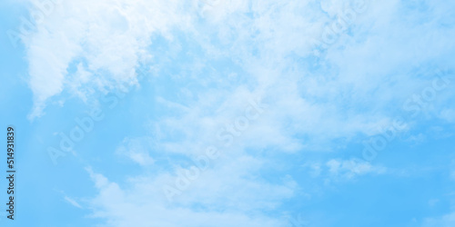 Abstract clear view of natural cloudy sky of winter seasons, Cloudy and bright shinny blue sky background with white clouds, fluffy and blurry summer sky background for wallpaper and design.
