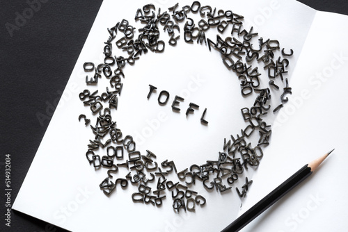 TOEFL - black latin letters word, English as a foreign language test, TOEFL concept, white background photo