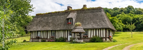 A thatched cottage in Normandy, on the banks of the Seine, beautiful house
