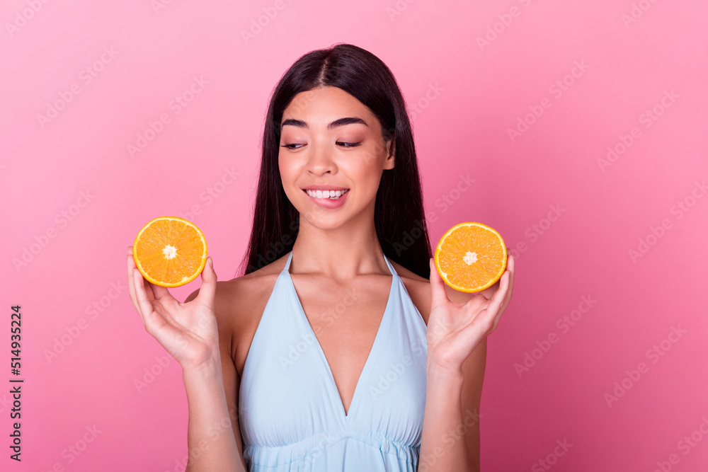 Photo of stunning lovely lady feel hungry bite lips want eat healthy mandarin slice isolated pastel color background Photo of stunning lovely lady feel hungry bite lips want eat healthy mandarin slice isolated pastel color background