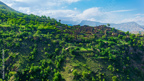 ruins of houses on a mountainside in Kurib, a depopulated village with the only remaining household with an apiary, Dagestan photo