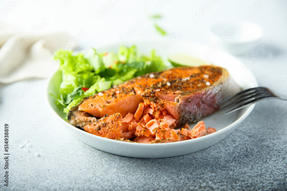 Roasted salmon steak with green salad