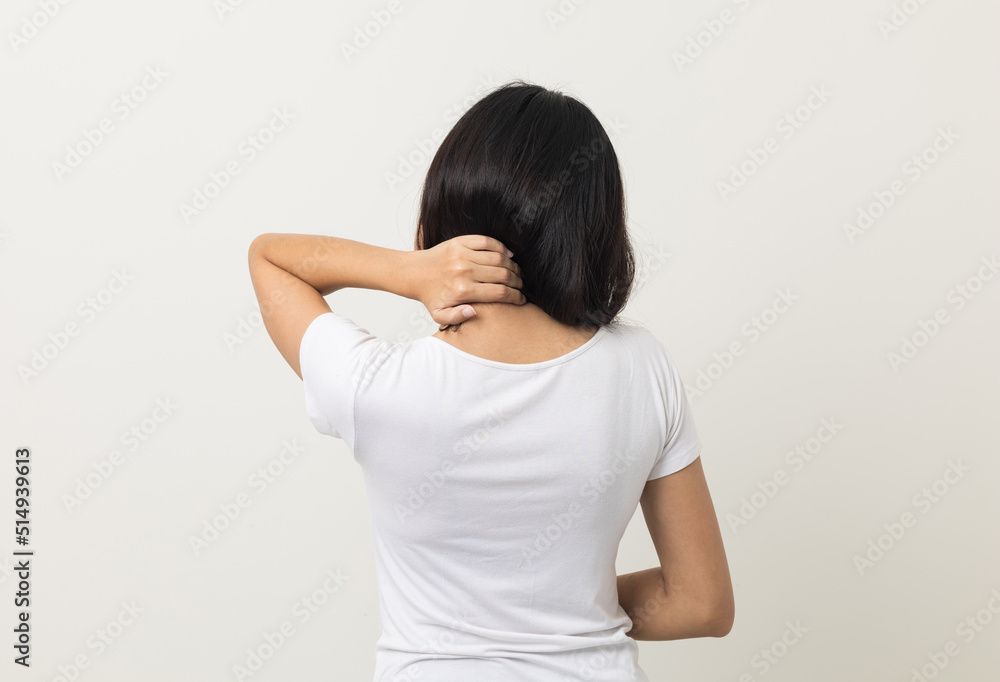 Asian woman has problem with structural posture She had neck and shoulder pain. She massaged her neck and shoulders for relief. reduce muscle tension. Standing on isolated white background Asian woman has problem with structural posture She had neck and shoulder pain. She massaged her neck and shoulders for relief. reduce muscle tension. Standing on isolated white background