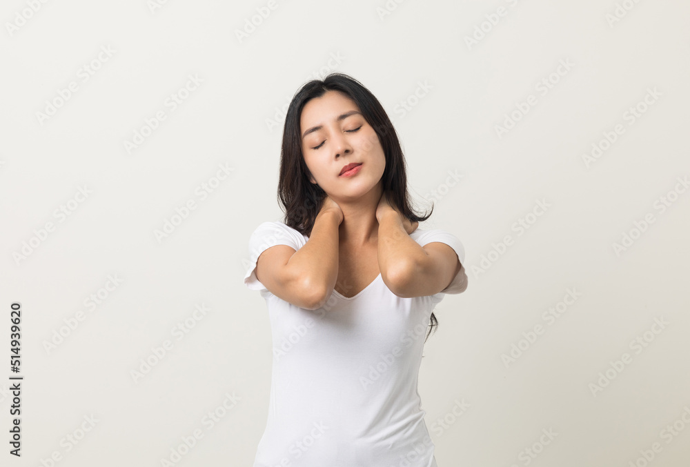 Asian woman has problem with structural posture She had neck and shoulder pain. She massaged her neck and shoulders for relief. reduce muscle tension. Standing on isolated white background Asian woman has problem with structural posture She had neck and shoulder pain. She massaged her neck and shoulders for relief. reduce muscle tension. Standing on isolated white background