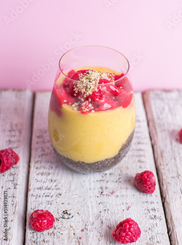 Healthy cold summer exotic smoothie with fruits and raspberries