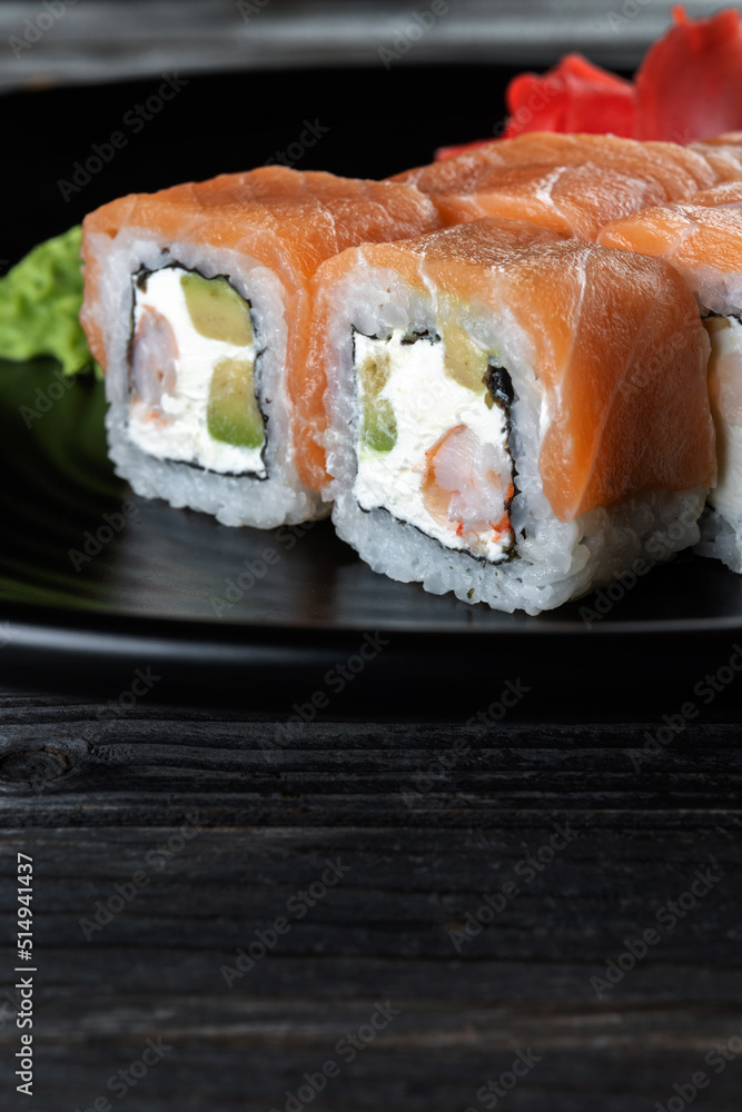 Close-up of fresh rolls and sushi set. Japanese cuisine. Tasty food. Close-up of fresh rolls and sushi set. Japanese cuisine. Tasty food.