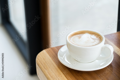 coffee cup on wood table background,Hot latte coffee with latte art
