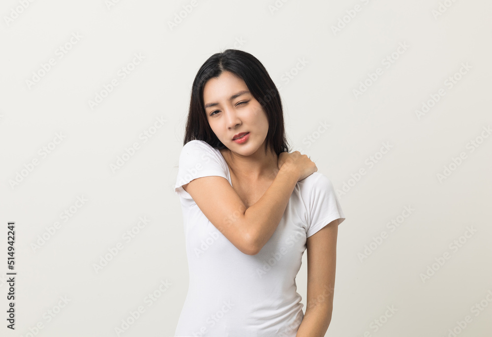 Asian woman has problem with structural posture She had neck and shoulder pain. She massaged her neck and shoulders for relief. reduce muscle tension. Standing on isolated white background Asian woman has problem with structural posture She had neck and shoulder pain. She massaged her neck and shoulders for relief. reduce muscle tension. Standing on isolated white background